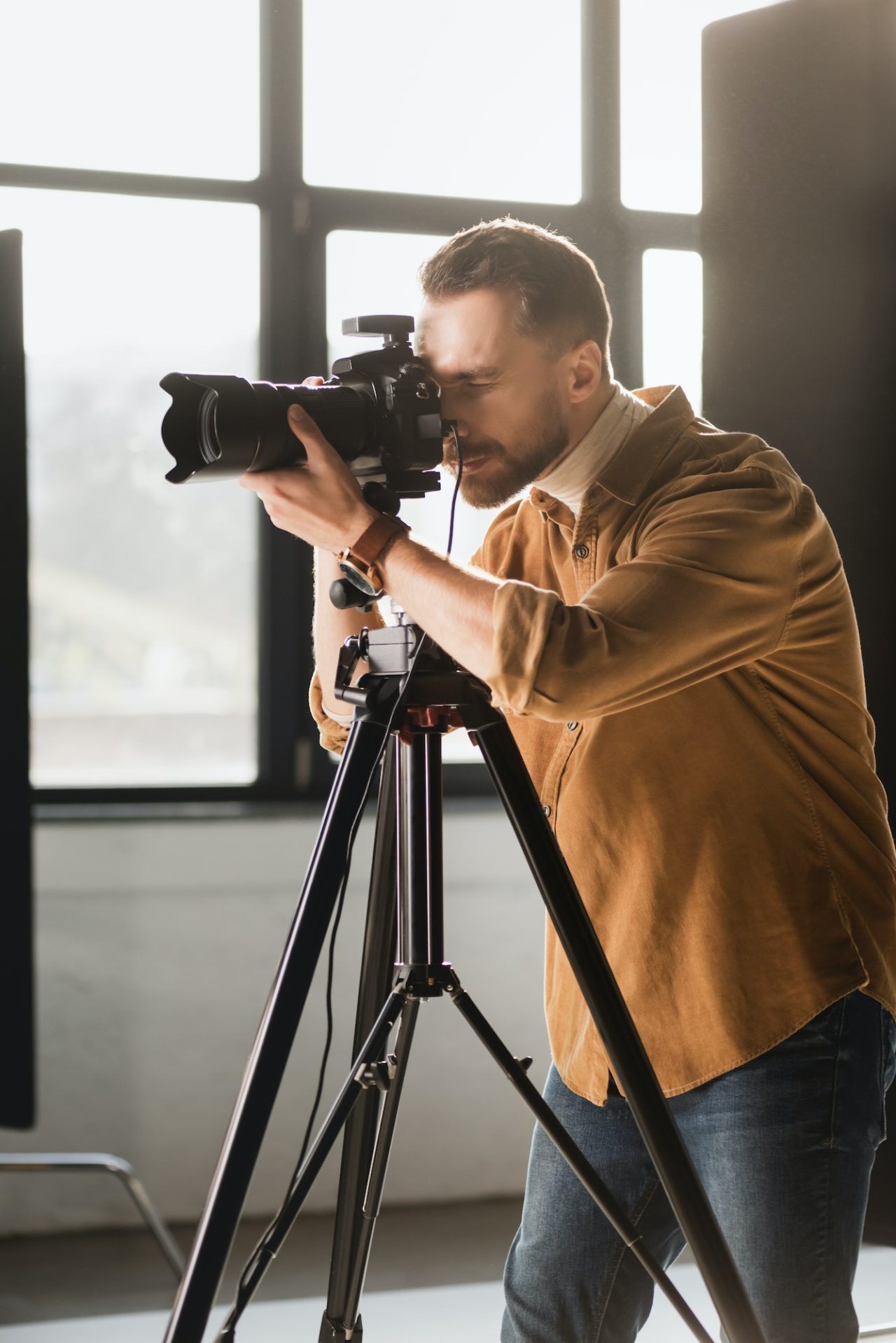 photographer taking photo with digital camera on backstage